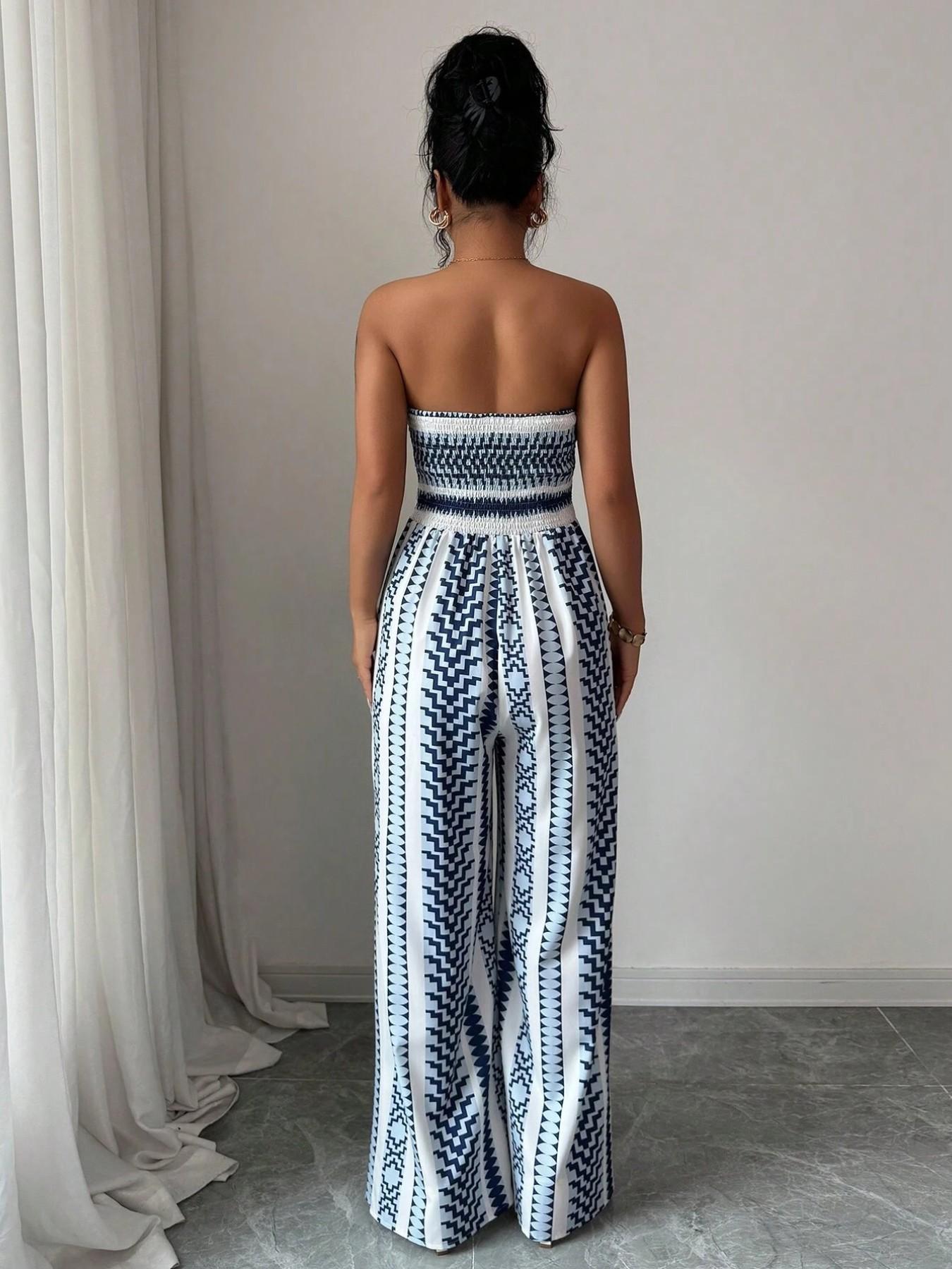 Vaelisse — Halter-Neck Jumpsuit mit geometrischem Druck und seitlichem Schlitz